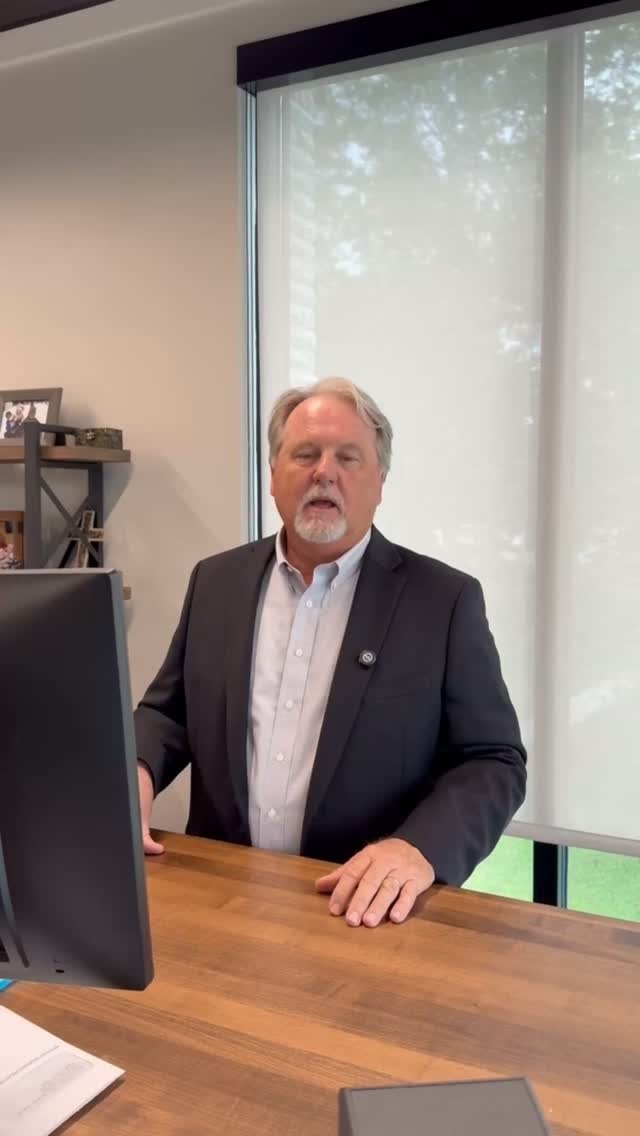 Williams Cummings standing in his office